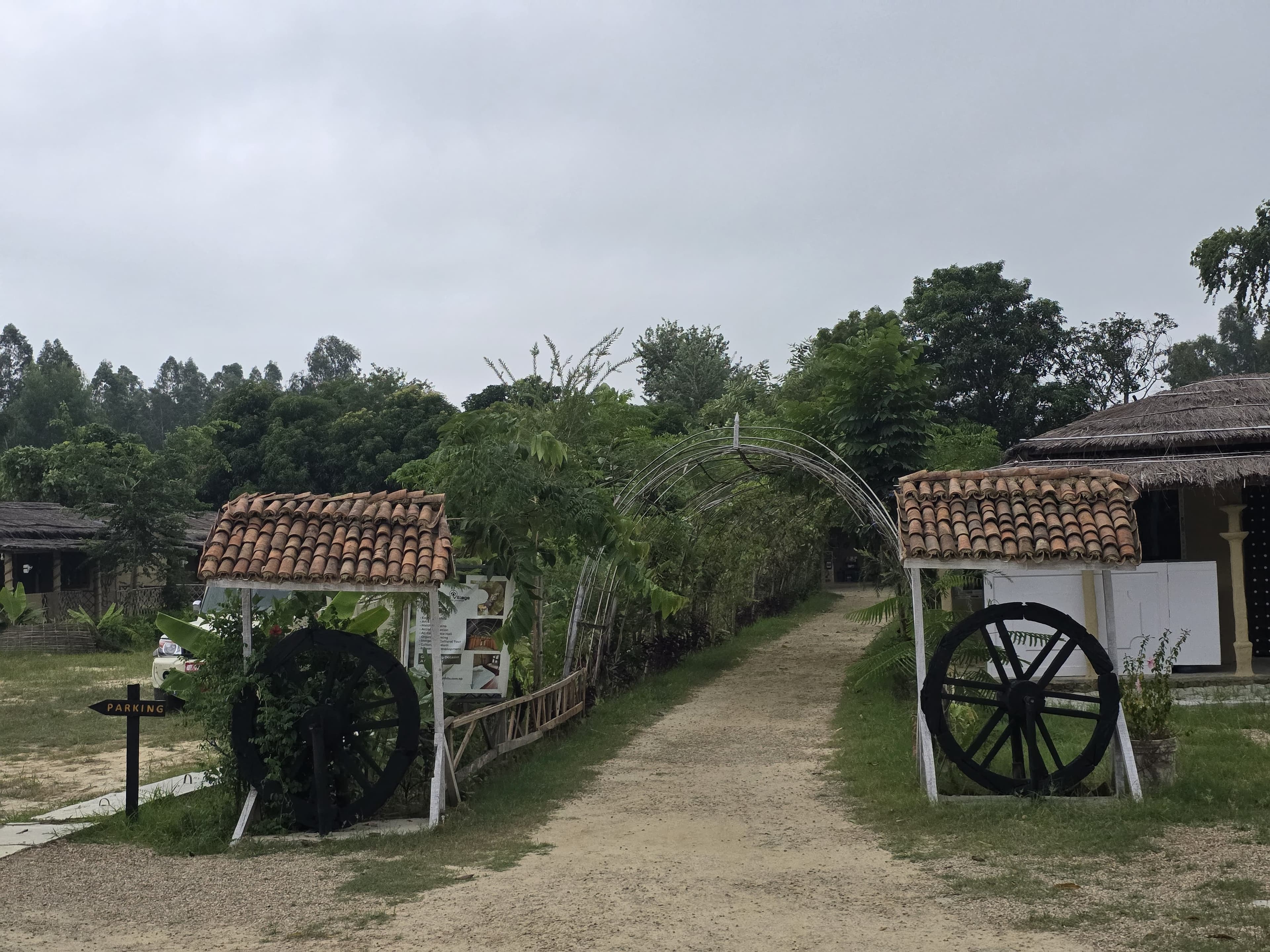 Rustic cart wheel gateway to the village