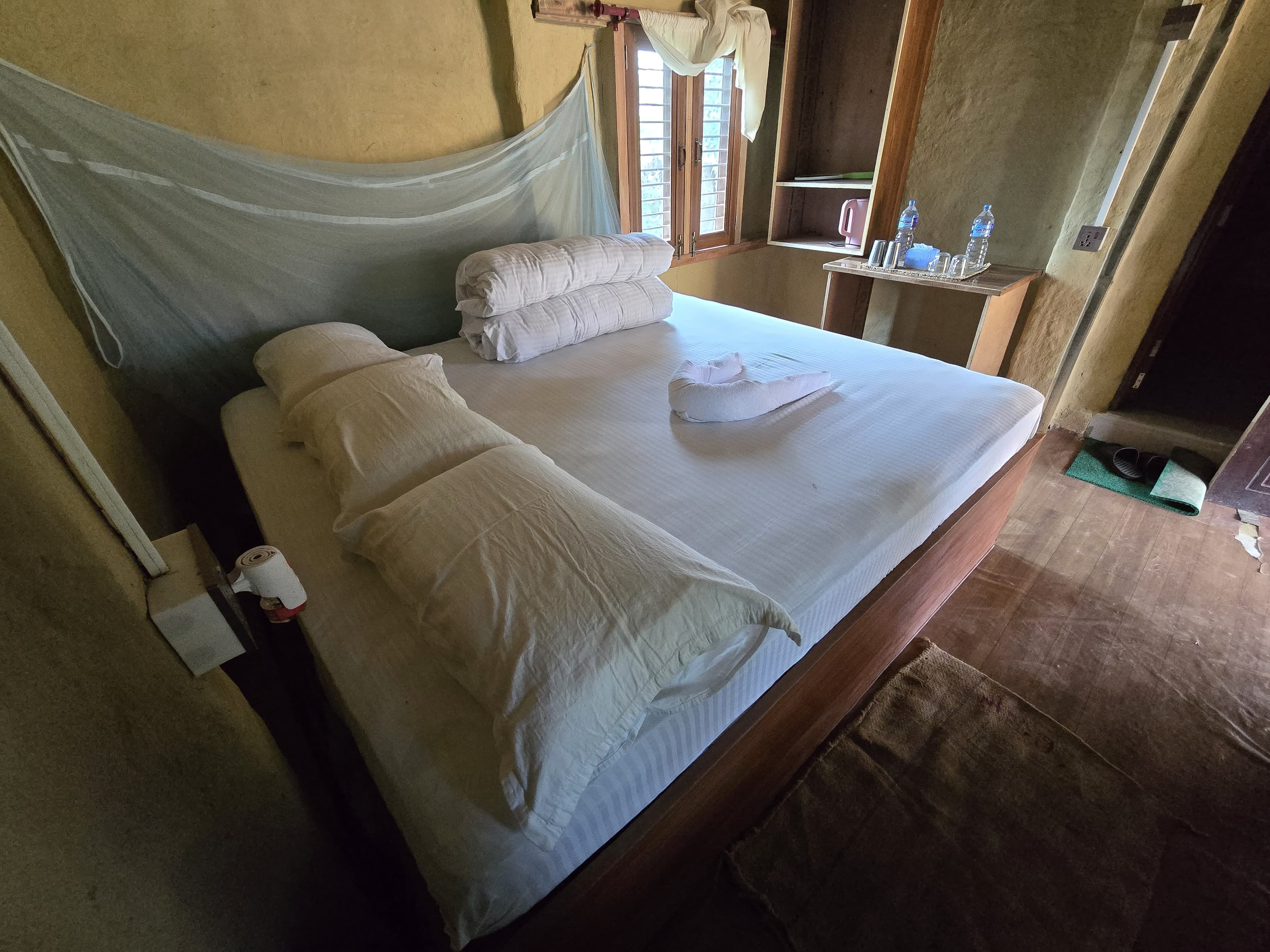 Heritage room with double bed and mosquito net canopy